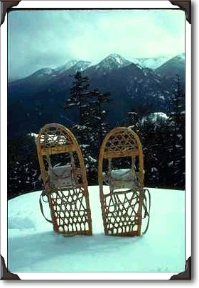 Snowshoes In Front Of Peaks