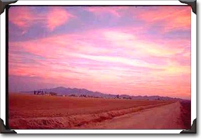 Skies glow over farmlands west of Phoenix