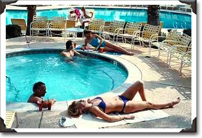 Couples around hotel pool in Palm Springs, California