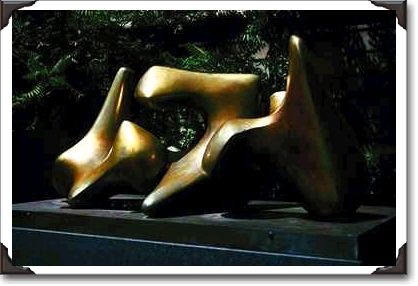 Bronze statue, three-piece reclining figure by Moore