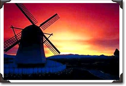Windmill silhouette with mountains, Skagit Valley, Washington State