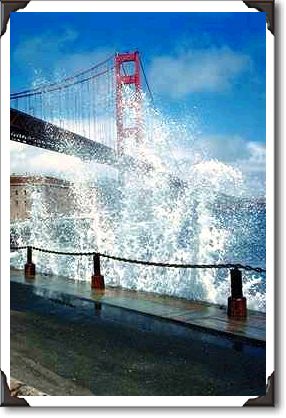 Golden Gate Bridge and wave spray from the seawall, San Francisco