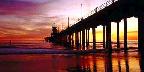 Low tide reflections at sundown, Huntington Beach pier, ...