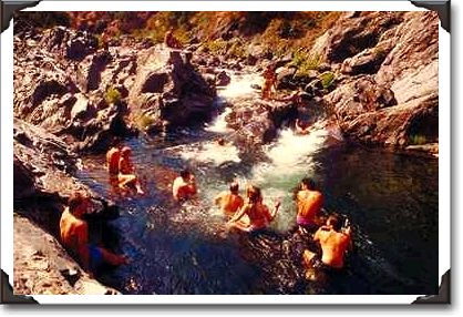 Hikers enjoy a High Sierra mountain pool