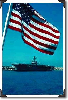 "USS Constellation" framed by flag, San Diego Naval Base, California