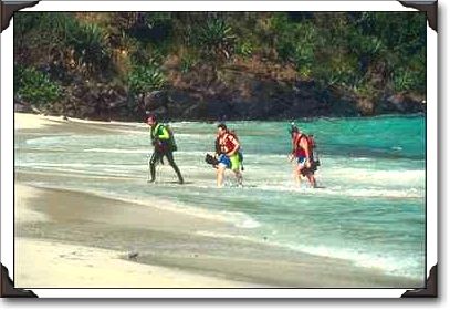 Divers emerge from the water, Coki Beach, St. Thomas
