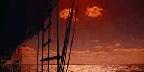 Ocean through rigging of tall ship, sunset off Florida