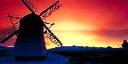 Windmill silhouette with mountains, Skagit Valley, Washington State