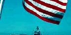 "USS Constellation" framed by flag, San Diego Naval Base, California